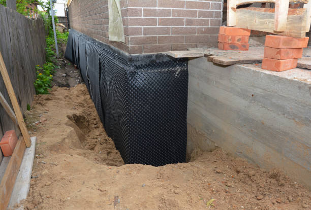 Happy homeowners after waterproofing job in Silver Grove
